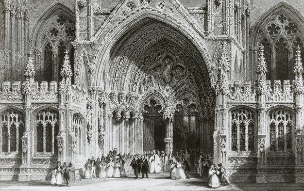 Black and white photograph. This photograph is of an engraving, so it appears to be a print at first glance. Dozens of people, the men in full suits and hats and the women in long, hoop skirts, are tiny in scale as they mill under the massive archivolt of Lincoln Cathedral.