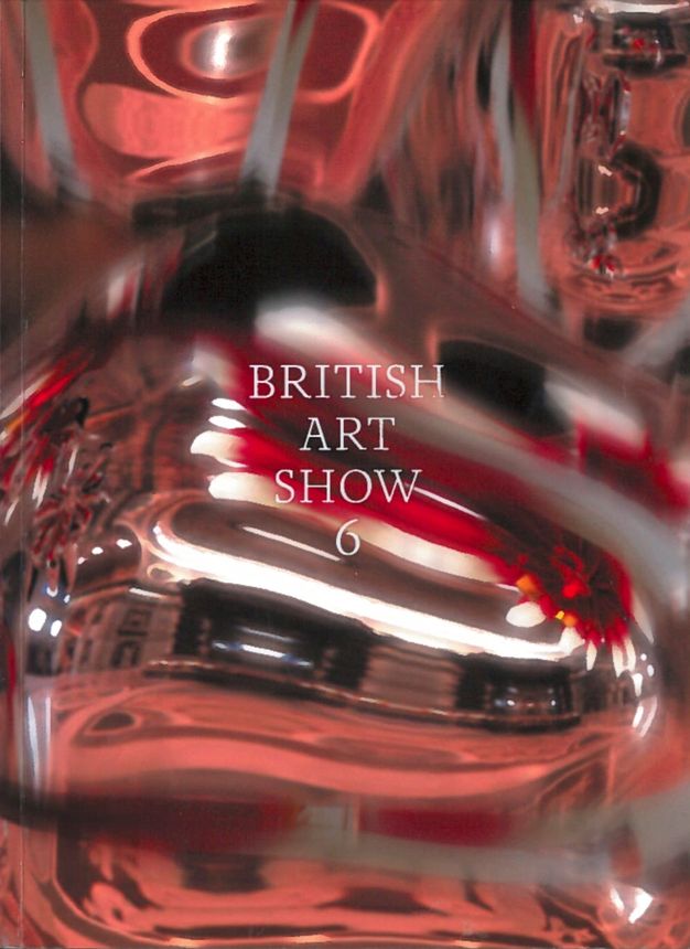 Cover of an exhibition catalogue. What appears to be a photograph of blurry bright lights and highly reflective surfaces creates a swirl of white, silver, red and pink. 